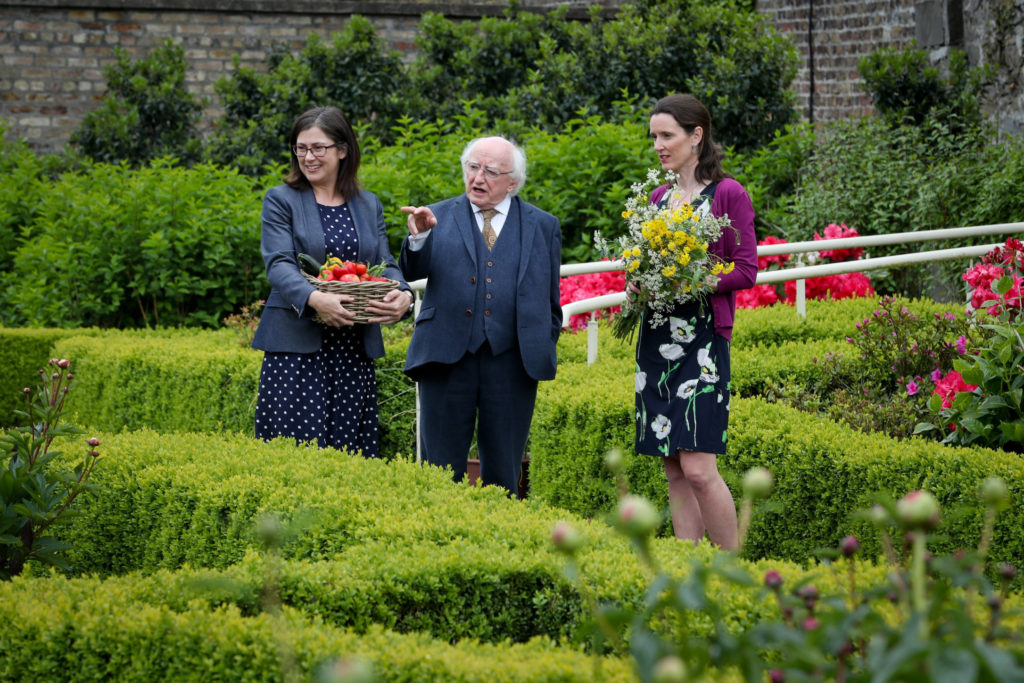 President Michael D Higgins shows his garden to Prof Jane Stout and Una Fitzpatrick
